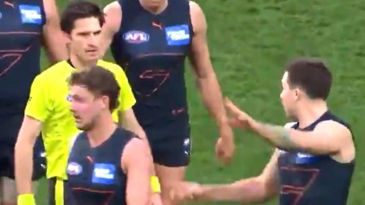 Toby Greene stops to talk to Matt Stevic after the contact. Picture: Fox Footy