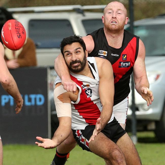 Bonbeach’s Trent Dennis-Lane tries to mark in front of Zac White of Frankston Bombers. Picture: Hamish Blair