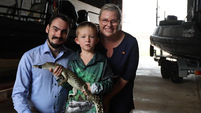 Deputy minister for Parks and Wildlife Andrew Mackay, young croc enthusiast and hopeful pet owner Layne, and Minister for Parks and Wildlife Marie-Clare Boothby with Burtie the juvenile crocodile. Picture: Sam Lowe