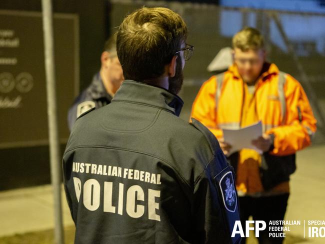 A Sydney subcontractor who allegedly used his role as a trusted insider to aid in the importation of 230 kilograms of methamphetamine has been arrested as part of further investigations linked to Operation Ironside. , The 34-year-old Gladesville man was arrested at Port Botany on Tuesday (10 August 2021). As part of the operation, the AFP first identified a 40-year-old Glebe man following intelligence obtained from the AN0M platform during Operation Ironside. Picture: AFP via NCA NewsWire,