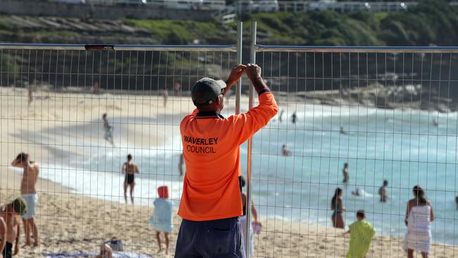 Waverley Council erecting a fence at Bronte Beach. Picture: Jane Dempster