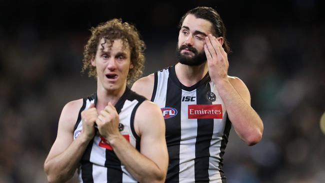 Grundy and teammate Chris Mayne after the preliminary final loss to GWS. Pic: Michael Klein