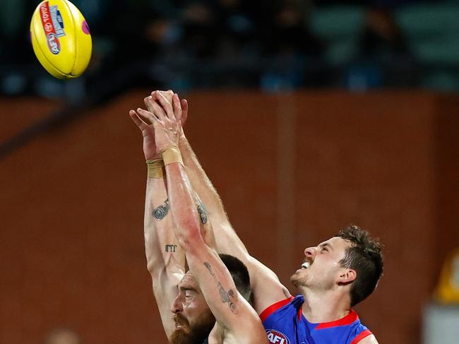 Zaine Cordy gets a fist in against Charlie Dixon. Picture: Getty