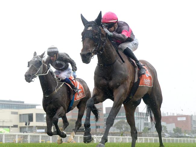 Plenty Of Ammo ridden by Jordan Childs wins the Allan Wicks Handicap at Caulfield Racecourse on December 26, 2023 in Caulfield, Australia. (Photo by Brett Holburt/Racing Photos via Getty Images)