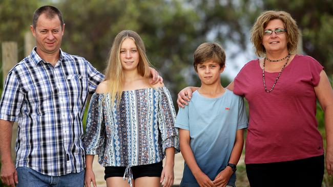 Nick and Andrea Foran with their children Bronte, 14, and Isaac, 11, at Blacksmiths Beach south of Newcastle. Picture by Peter Lorimer.