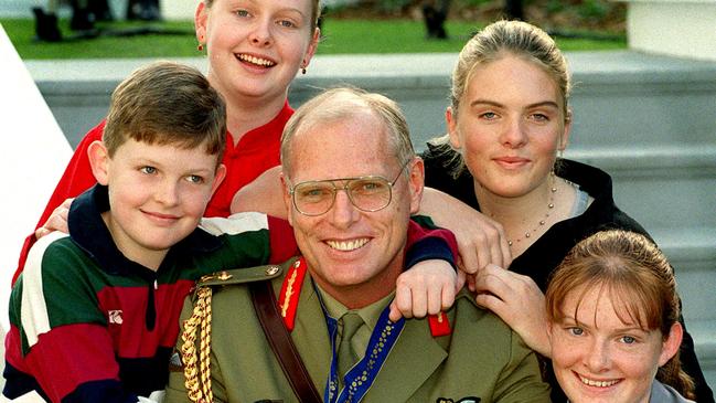 Jim Molan with his children Michael 11, Sarah 18, Erin 16 and Felicity 15 after he received his AO [military] for distinguished service to the Australian Defence Force in Jakata.