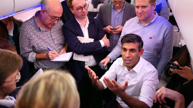 British Prime Minister Rishi Sunak holds a ‘huddle’ press conference on board a government plane bound for the G-20 in Indonesia. Picture: Getty Images