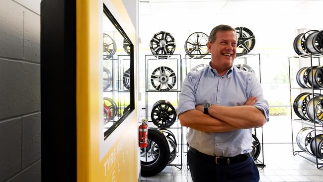 Queensland Opposition Leader Tim Nicholls with mag wheels at Jax Tyres in Mitchelton. Picture: AAP/Tracey Nearmy