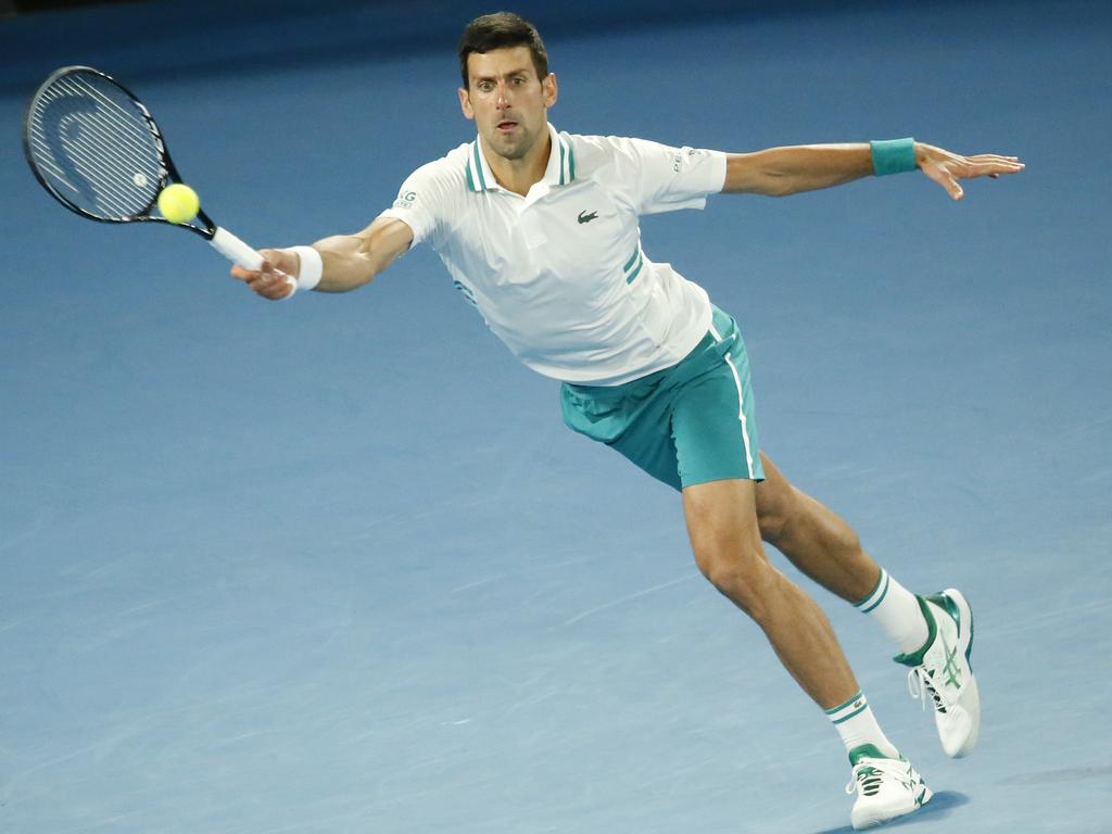 World No.1 Novak Djokovic stretches for a defensive forehand during the 2021 Australian Open final against Daniil Medvedev. Picture: David Caird