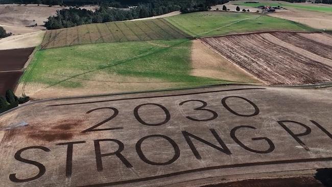 Tasmanian Premier Jeremy Rockliff has revealed what is believed to be Australia’s largest ever election billboard, that’s twice the size of the MCG, ploughed on the ­paddocks at his mother’s Sassafras farm. Picture: Handout via NCA NewsWire