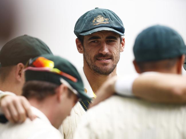 MELBOURNE, AUSTRALIA - DECEMBER 29: Mitchell Starc of Australia looks on in the team huddle during day four of the Second Test match in the series between Australia and South Africa at Melbourne Cricket Ground on December 29, 2022 in Melbourne, Australia. (Photo by Daniel Pockett/Getty Images)