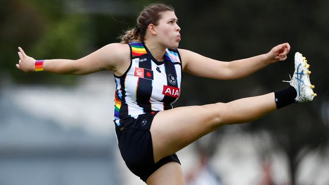 Imogen Evans of the Magpies kicks the ball during the Round 09 match with North Melbourne at Victoria Park on October 22, 2022. (Photo by Dylan Burns/AFL Photos via Getty Images)