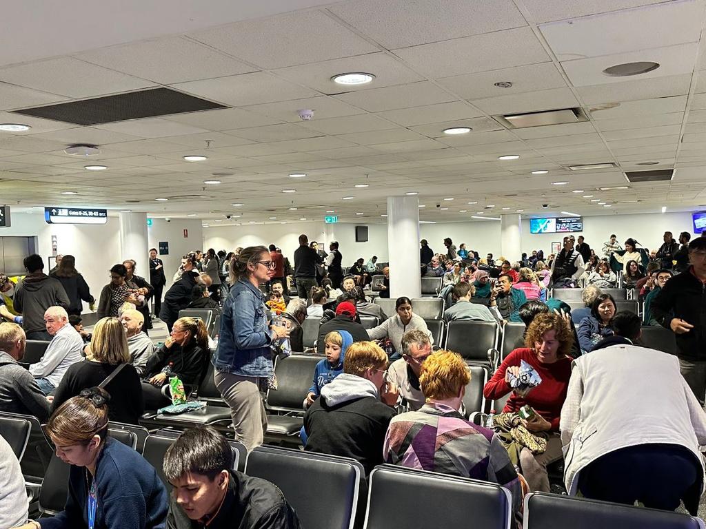 Malaysian Airlines passengers waiting in Sydney airport after disembarking a plane that was forced to turn back following an incident on board. Picture: Supplied.