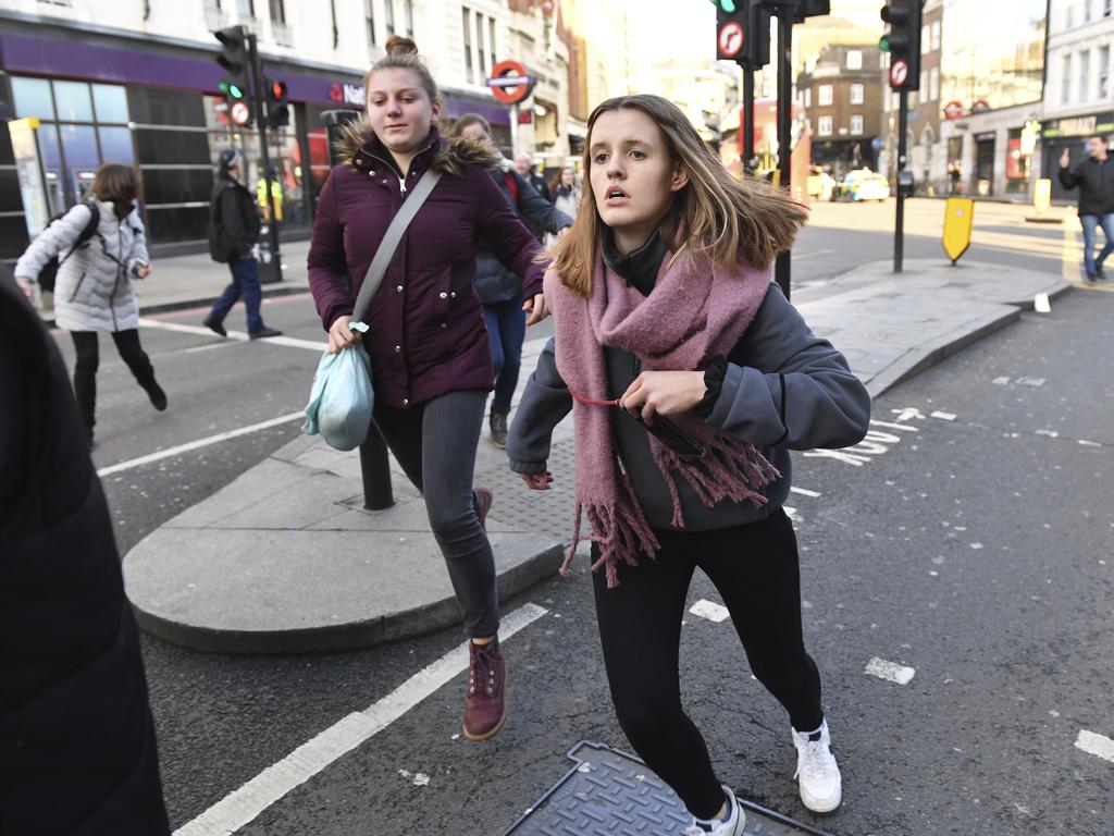 People are evacuated from London Bridge in central London following a police incident. Picture: Dominic Lipinski/PA via AP.