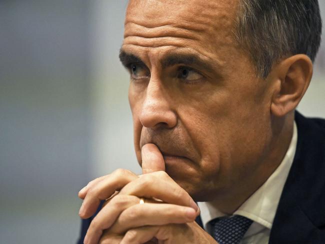 Governor of the Bank of England Mark Carney, pauses during the Bank of England Financial Stability Report press conference, at the central bank in central London on July 5, 2016. The Bank of England on Tuesday relaxed commercial banks' capital requirements to boost lending to businesses and households, and warned that financial stability risks 