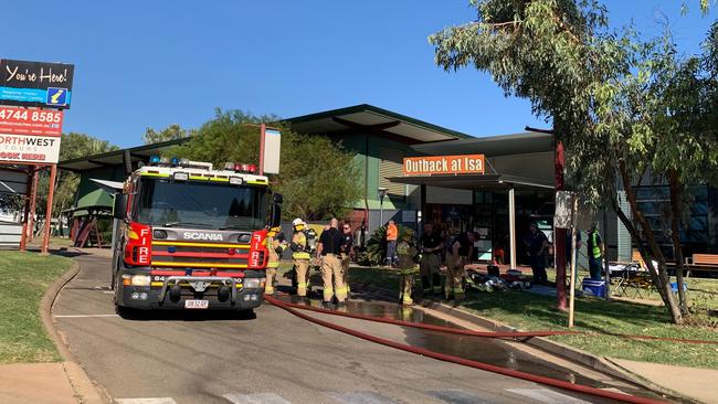 Firefighters monitor the scene of a fire at Outback at Isa, Mount Isa on Saturday, May 9, 2020. Photo: Danielle Slade