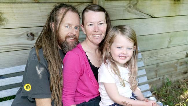 Pictured at their Bilambil Heights home, Jon Boniface who has been diagnosed with lymphoma and leukaemia. Pictured with his wife Bronwyn Boniface and daughter Mireille Boniface, age 5. Picture Mike Batterham