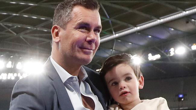 Wayne Carey with son Carter during the 2022 AFL Round 21 match between the Kangaroos and the Swans. Picture: Getty Images