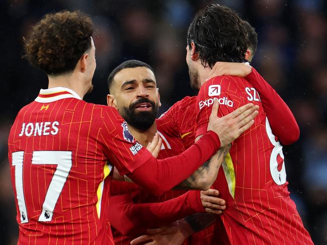 Dominik Szoboszlai celebrates scoring Liverpool's second goal with teammates Curtis Jones and Mohamed Salah. Picture: Getty Images