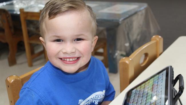 Harvey Hart struggled to communicate with his family prior to receiving his AAC device. Picture: Supplied.