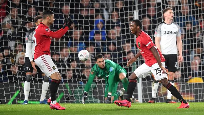 Manchester United’s Odion Ighalo, right, celebrates after scoring his side’s third goal against Derby County in the FA Cup fifth round tie at Pride Park. Picture: Getty Images