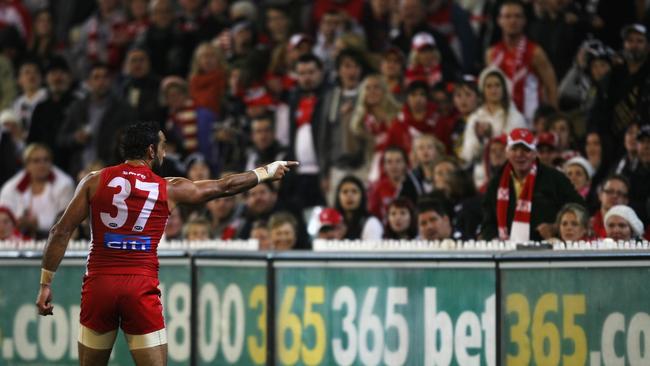 Adam Goodes points into the crowd alerting security to comments made during the 2013 AFL match between the Collingwood Magpies and the Sydney Swans at the MCG. Picture: AFL Media