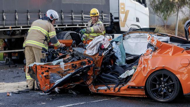 A passenger was killed when a Ford Mustang ploughed into the back of a parked truck in a horrific smash in Melbourne’s west. Picture: NewsWire / David Geraghty