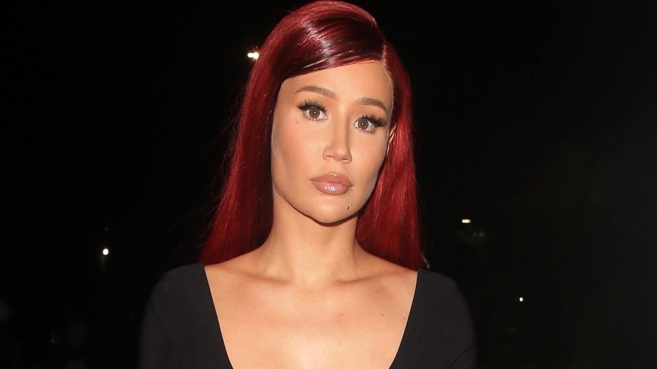 Iggy Azalea reveals red hair at perfume and video launch after ...