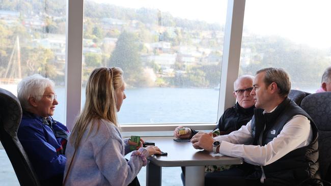 Transport Minister Michael Ferguson speaks to Derwent Ferry passengers