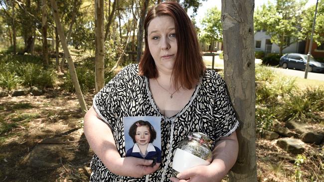 Rebecca Johns with her daughter Alison's ashes and photo. Picture: Andrew Henshaw