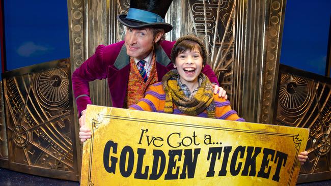 Willy Wonka (Paul Slade Smith) and Charlie (Lachlan Young) with a golden ticket. Picture: Sarah Matray