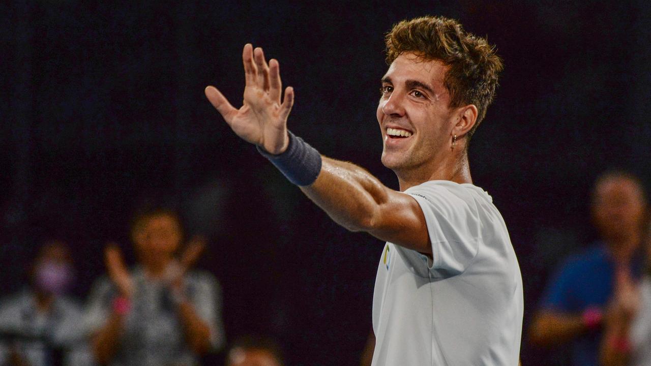 Thanasi Kokkinakis thanks the Adelaide crowd after winning his maiden ATP Tour singles title over France’s Arthur Rinderknech on Saturday night. Picture: AFP