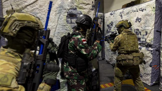 Australian Amphibious Force Ground Elements from the 1st Battalion, RAR, conduct urban assault training with Indonesian National Armed Forces on the Heavy Vehicle Deck of HMAS Adelaide, during Exercise Talisman Sabre 23. Picture: Emma Schwenke