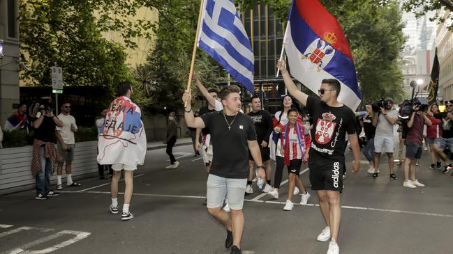 Crowds gather in support of Novak Djokovic, shouting "Free Novak"