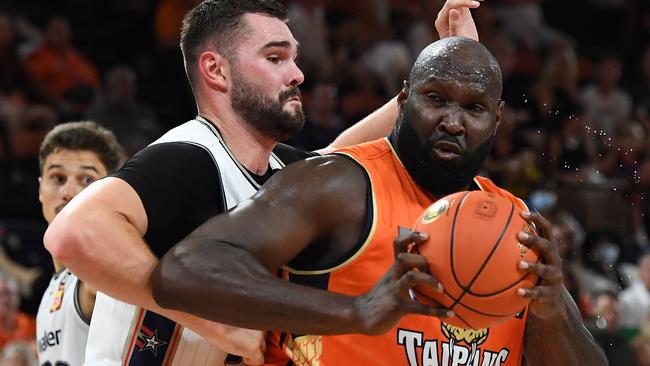 Nathan Jawai of the Taipans controls the ball under pressure from Isaac Humphries of the 36ers. (Photo by Albert Perez/Getty Images)