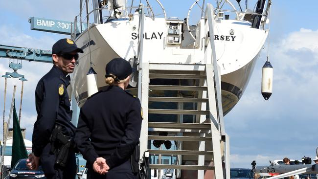 Australian Border Force officers guard the yacht Solay in Brisbane, Thursday, Sept. 3, 2015. Seventy kilograms of cocaine was seized by authorities when the boat berthed at Coomera on the Gold Coast last week. (AAP Image/Dan Peled)