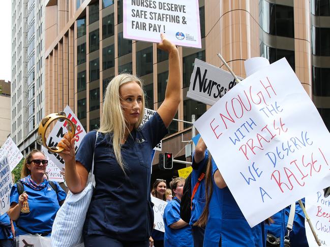 SYDNEY, AUSTRALIA : NewsWire Photos - NOVEMBER 13 2024; Nurses and midwives hold a 24-hour statewide strike, as frontline workers rally today. They march from Hyde Park down Elizabeth street to outside Parliament House in Sydney, with demands for fair wages, while patients across NSW will be left waiting. Picture: NewsWire / Gaye Gerard