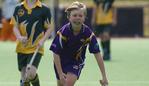 Macarthur Chronicle - Pictured: Julian Cook (Harrington Park) on the ball - Ingleburn Bulldogs (green yellow) versus Harrington Park Hurricanes (purple) - Macarthur District Juniors hockey finals 2014 held at Millwood Avenue, Narellan NSW Australia