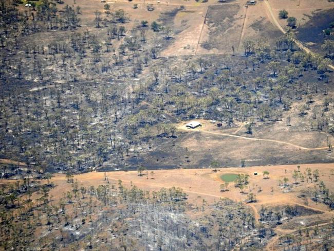 A lone property in the Stanwell area stands like an island surrounded by parched earth - an indication of the work done by firefighters to protect homes. Picture: Allan Reinikka