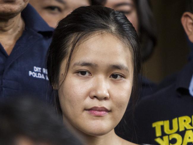 Police guard Jessica Kumala Wongso at Pondok Bambu Penitentiary in Jakarta, Indonesia on Friday, May 27, 2016. The police have named Wongso a suspect in the murder of Wayan Mirna Salihin, who died soon after allegedly drinking cyanide-laced coffee at a restaurant in Jakarta, on Jan. 6. (AAP Image/Oscar Siagian) NO ARCHIVING