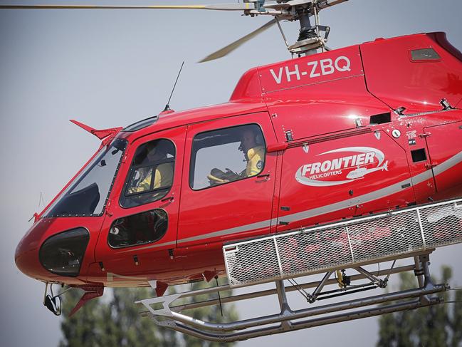 Helicopters and crew coming and going from the Fenton Forest fire camp and air base. Picture: MATHEW FARRELL