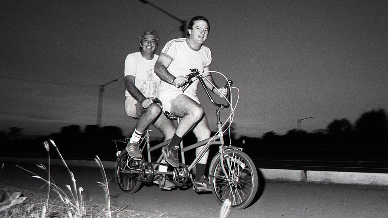 Then Chief Minister Paul Everingham (r) and Nick Dondas (l) ride to work in style on May 19, 1982.