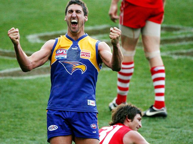 Dean Cox and a dejected Brett Kirk after the 2006 grand final.