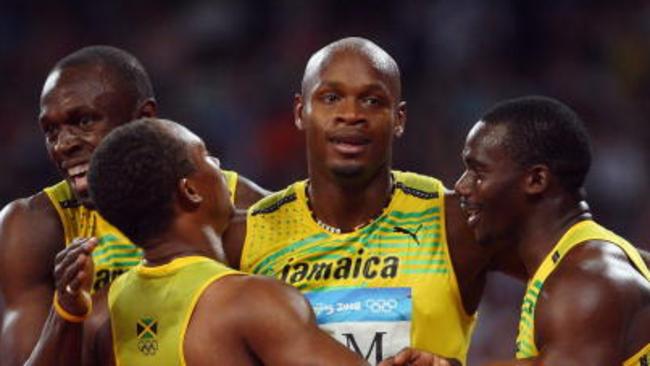 Usain Bolt, Michael Frater, Asafa Powell and Nesta Carter of Jamaica celebrate the gold medal after the Men's 4 x 100m Relay Final in Beijing.