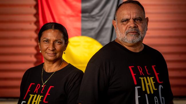 Nova Peris and Michael Long stand with the Aboriginal Flag. Picture: Che Chorley