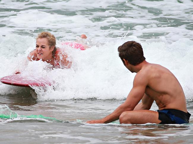 Tackling the waves on a vintage board. Picture: Adam Yip