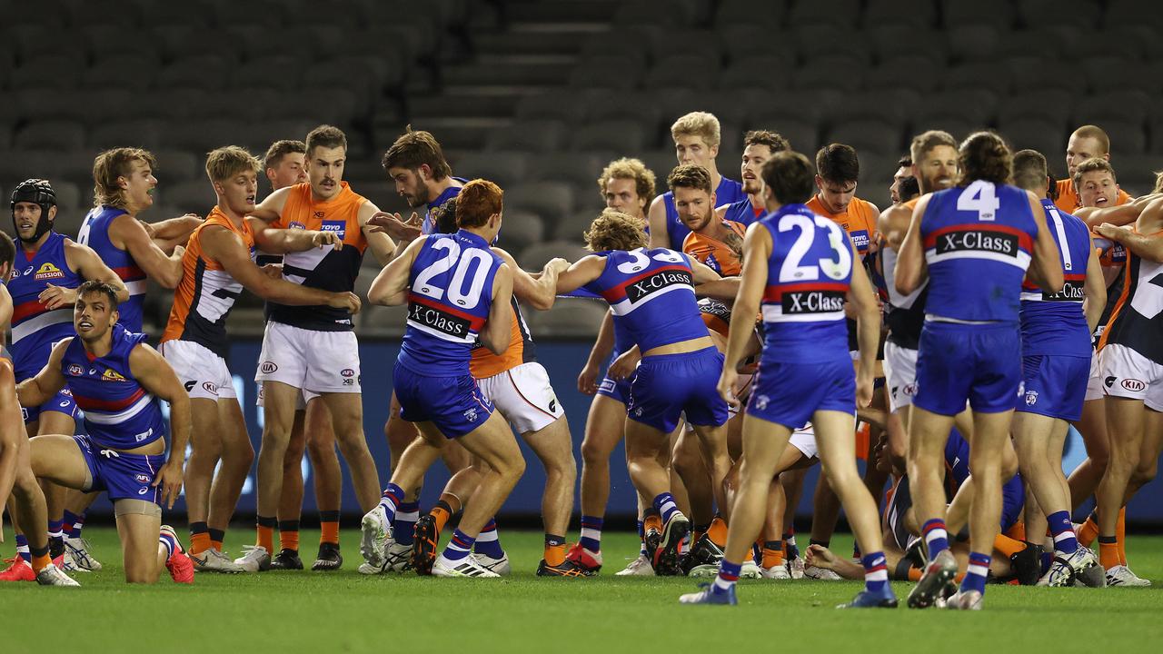 A wide view of the three-quarter-time melee, including a bloodied Sam Lloyd (left). Photo: Michael Klein