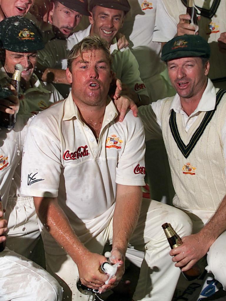 Shane Warne spraying champagne after a Test win in 2000.