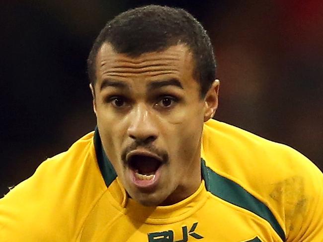 CARDIFF, WALES - NOVEMBER 30: Will Genia of Australia runs with the ball during the international match between Wales and Australia at the Millennium Stadium on November 30, 2013 in Cardiff, Wales. (Photo by David Rogers/Getty Images)