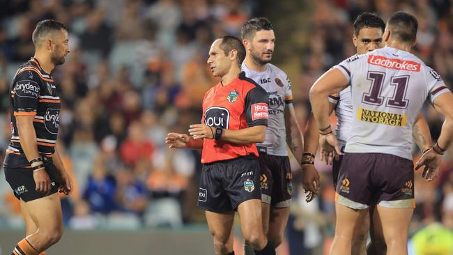 Referee Ashley Klein talks to Tigers Captain Benji Marshall after he awarded a penalty.